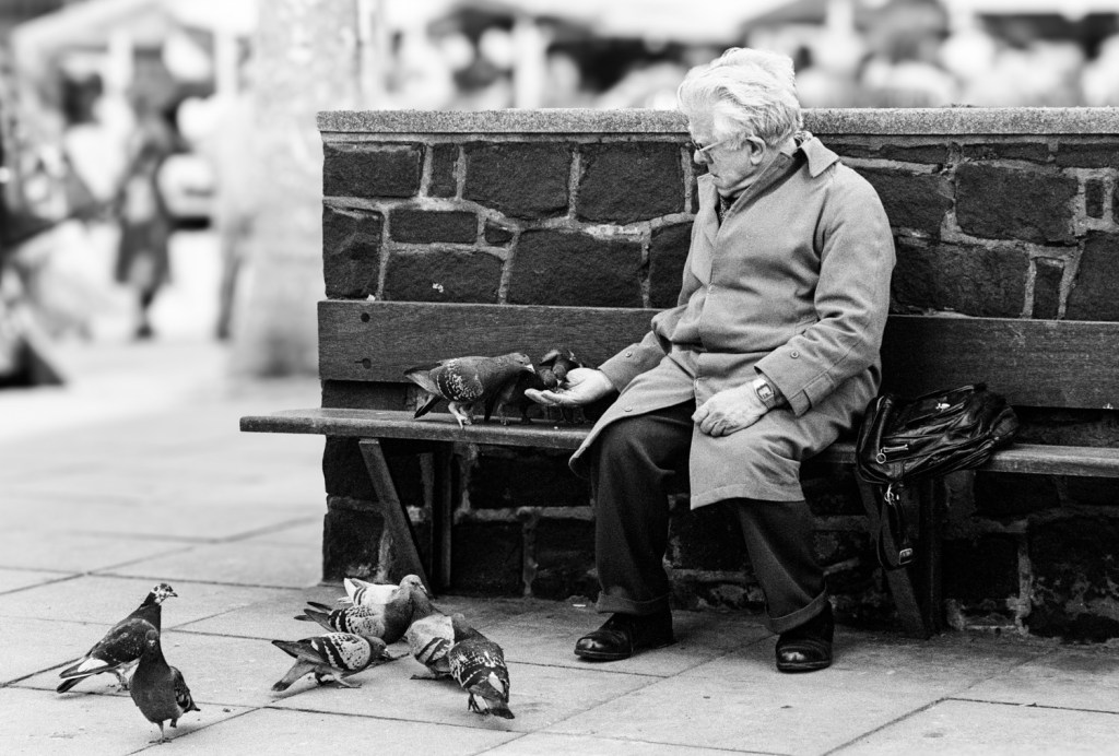 Feeding pigeons, Birmingham, 1979
