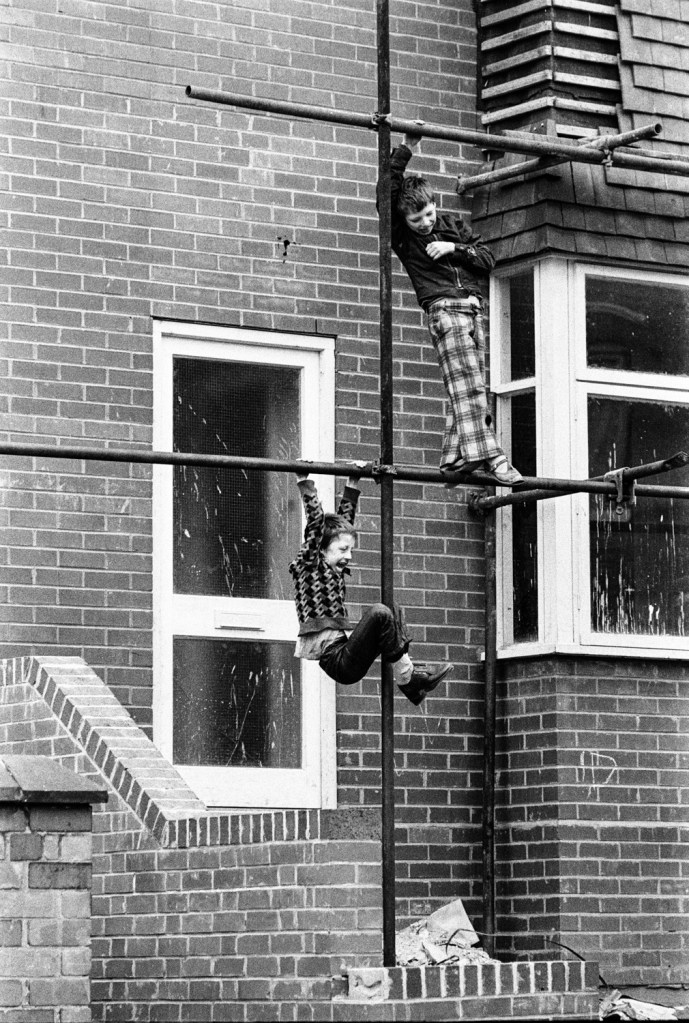 Kid's playing on scaffold, Wolverhampton, 1979